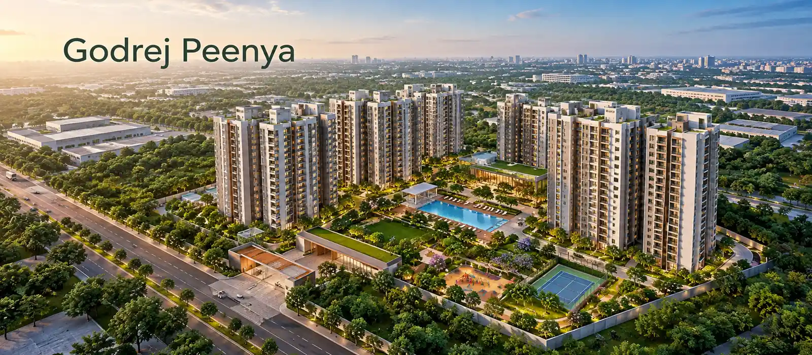 Aerial view of Godrej Peenya apartment towers with central pool and landscaped deck at Peenya, Bengaluru